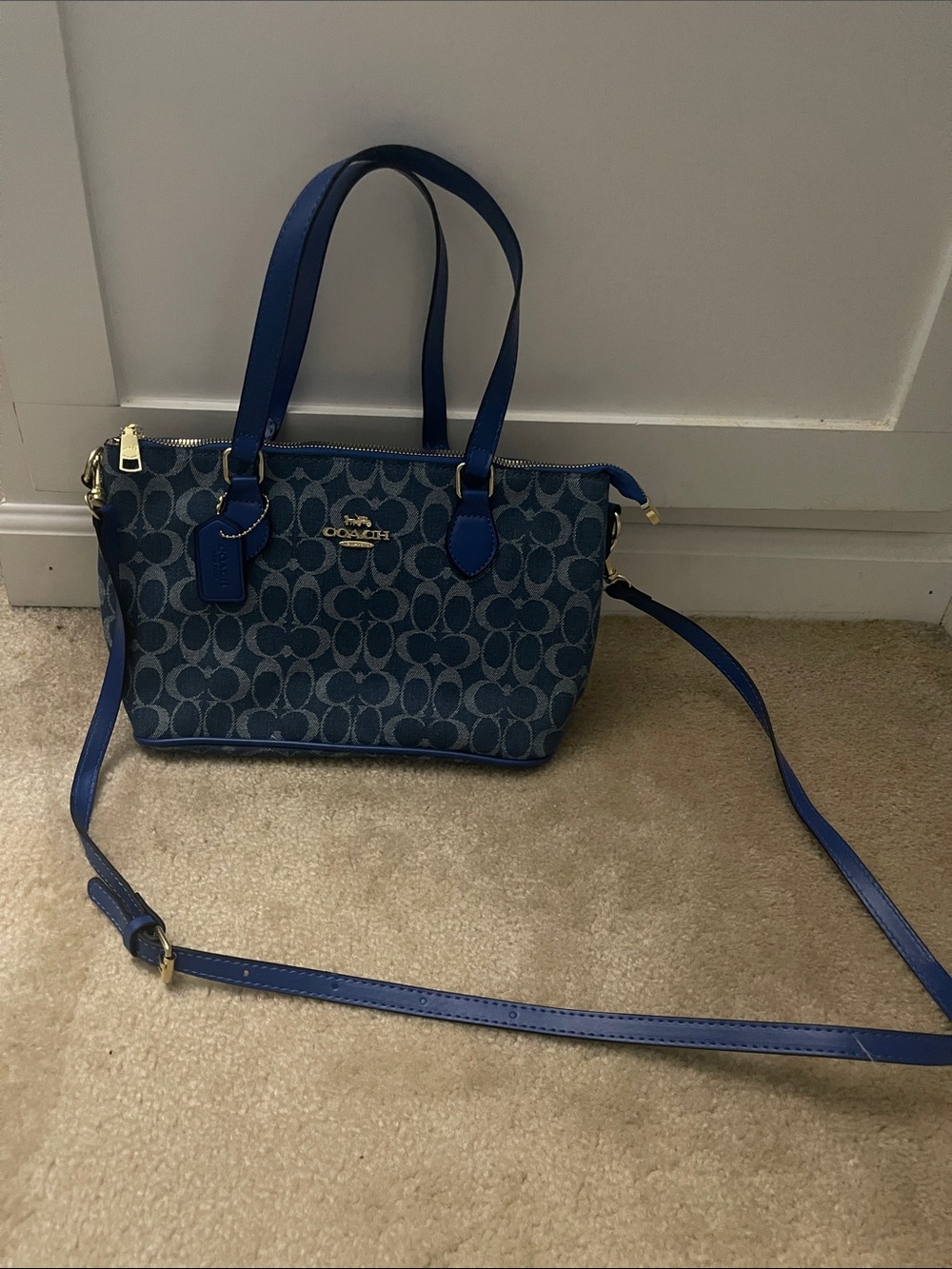 Coach Denim shoulder bag with detachable crossbody strap.